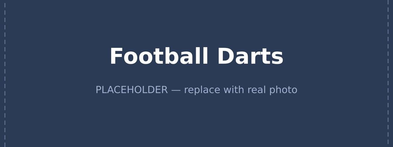 Giant inflatable football dartboard with velcro footballs stuck across the scoring rings