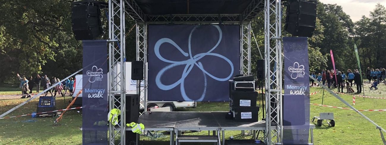 Branded mini stage set up for Memory Walk in park