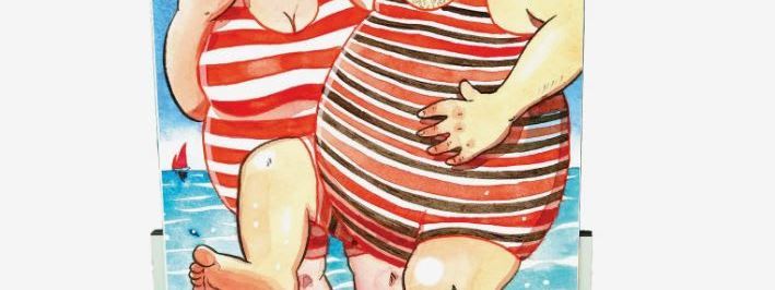 Painted face-in-the-hole board showing two seaside bathers in striped Victorian swimsuits paddling in the sea