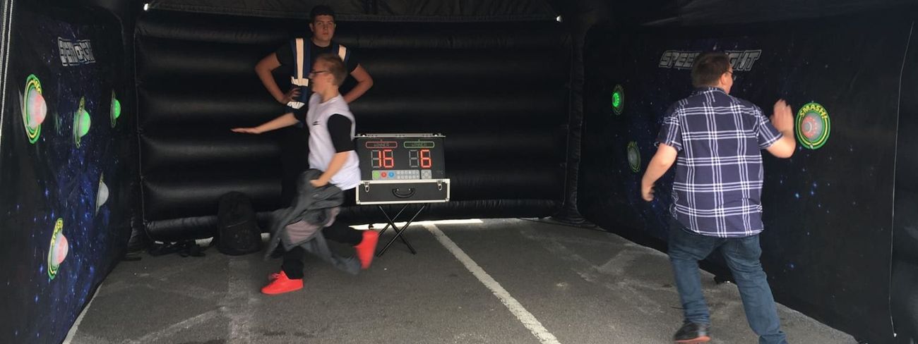 Players competing inside the inflatable arena outdoors