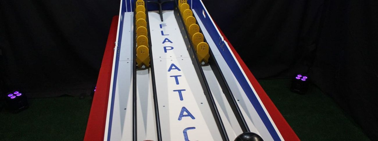 Blue and white Flap Attack two-lane skill game with two bowling balls and yellow scoring flaps
