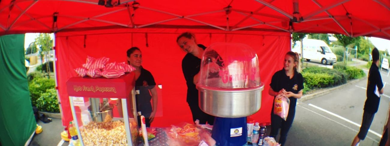 Outdoor gazebo stall with popcorn and candy floss machines