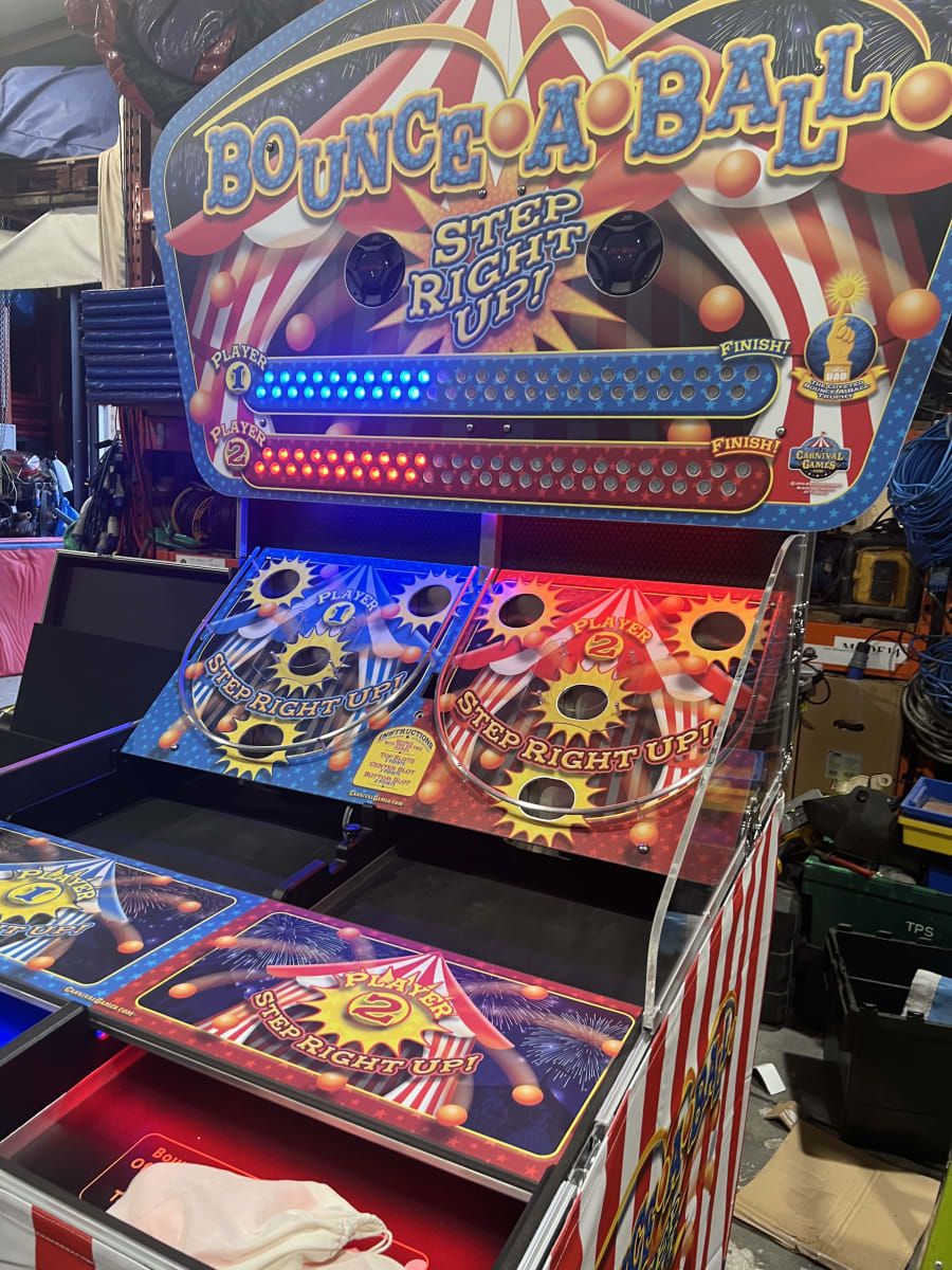 Children playing carnival games at a school fun day