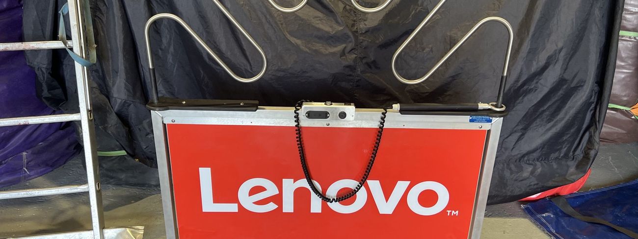 Giant buzz wire game with full Lenovo branding on the side panels at an exhibition stand