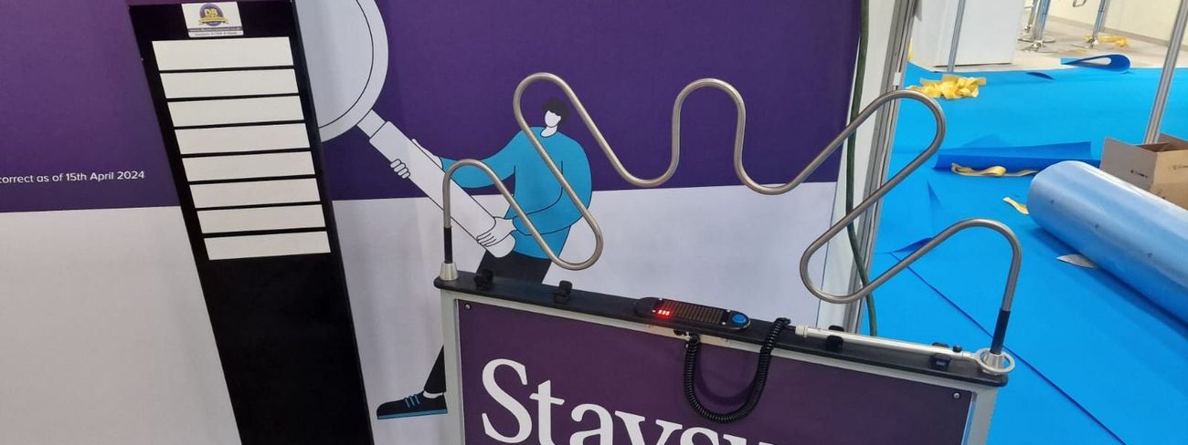 Branded leader board next to a Giant Buzz Wire interactive game at a corporate event