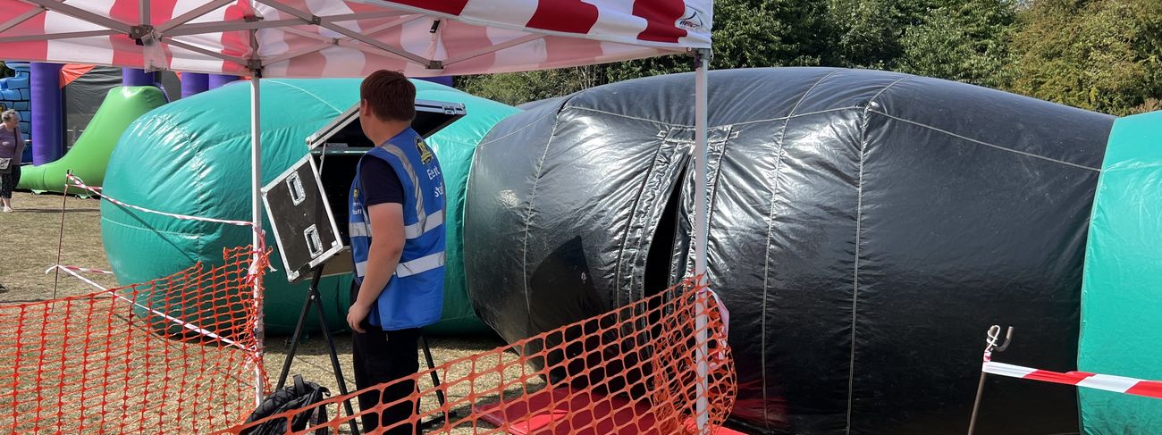 Ballnado Grabber prize game set up at a corporate event with branded panels