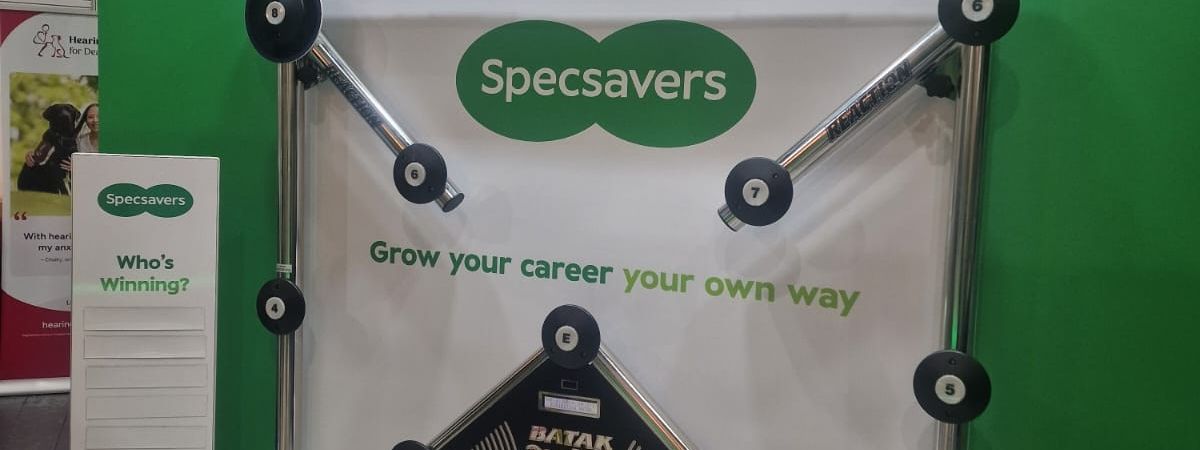 Specsavers-branded Batak Pro reaction wall with a scoring leader board