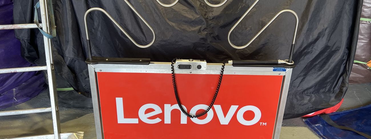Giant buzz wire game with full Lenovo branding on the side panels at an exhibition stand