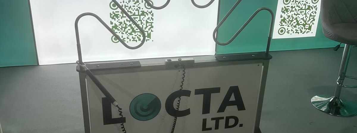 Giant buzz wire game with full Locta branding on the side panels