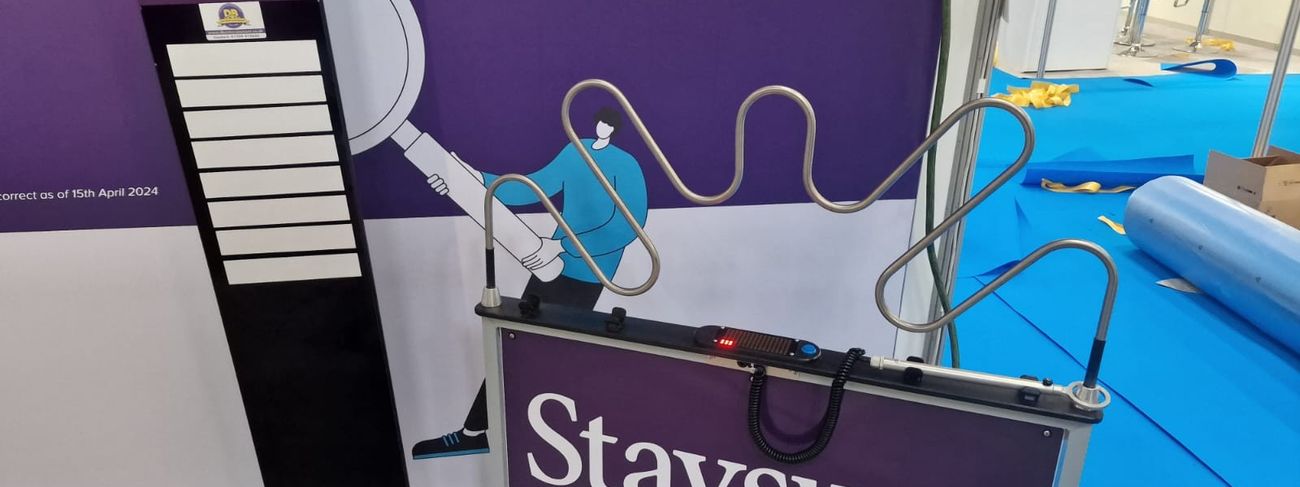 Branded leader board next to a Giant Buzz Wire interactive game at a corporate event