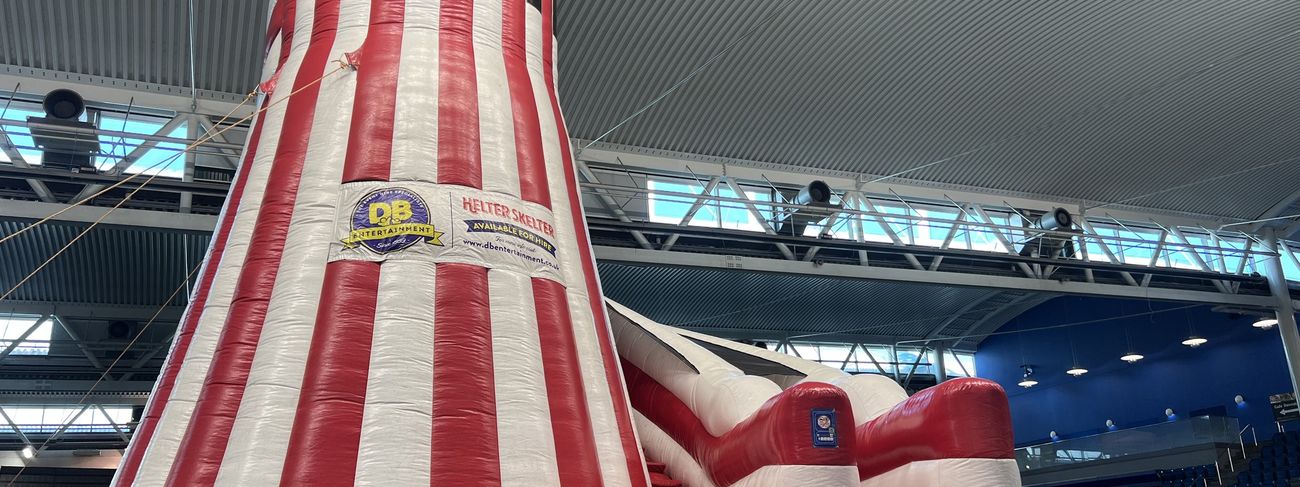 Giant traditional helter-skelter slide at an outdoor arena event
