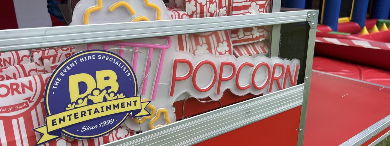 Traditional Pop Corn cart styled with branding signage at an event