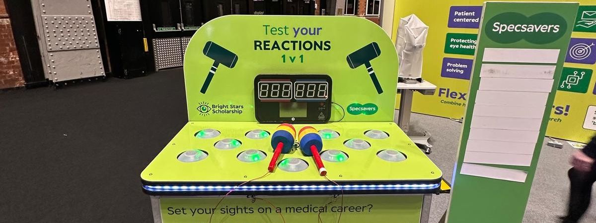 Whack-a-mole game with custom Specsavers branding on the side panels