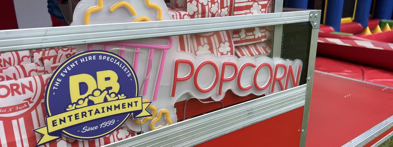 Traditional Pop Corn cart styled with branding signage at an event