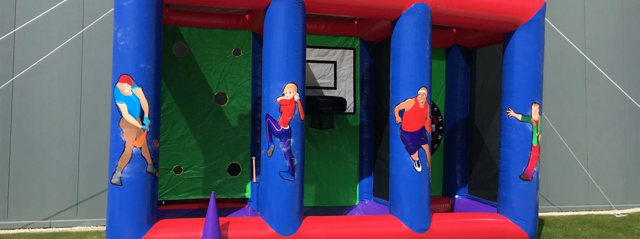Inflatable game stall set up outdoors on grass