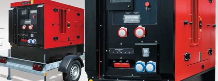 Red and black 30 kVA diesel generator on a galvanised single-axle road tow