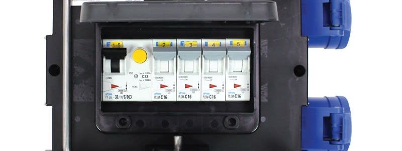 PCE 32 amp power distribution box with breakers behind a clear cover and blue 16 amp outlets