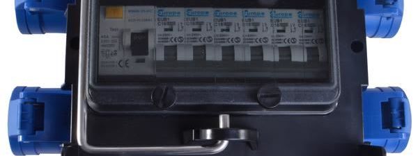 Top-down view of a 32 amp IMST power distribution box with eight blue 16-amp outlets and an internal RCD