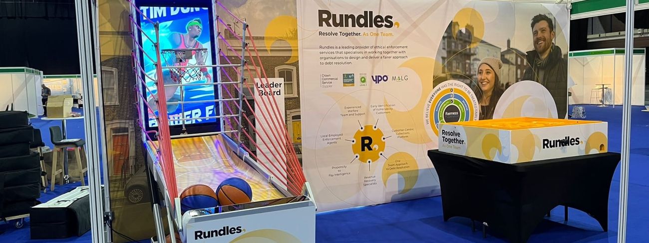 Interactive basketball arcade machine on a fully branded Rundles exhibition stand