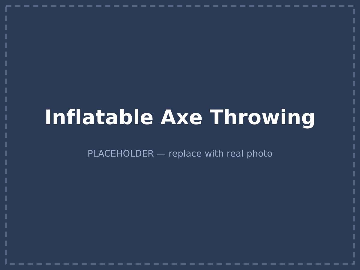 Two players throwing soft axes at velcro target boards inside an inflatable surround