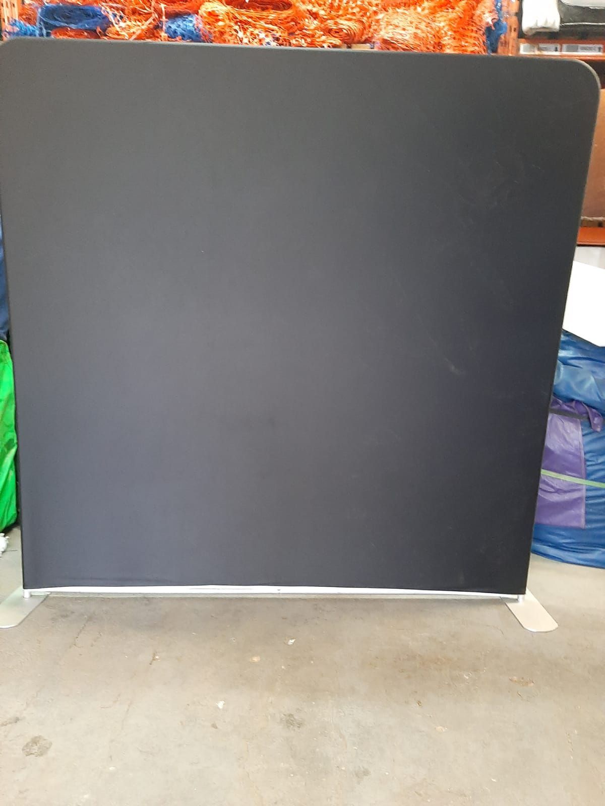 Plain black backdrop in storage