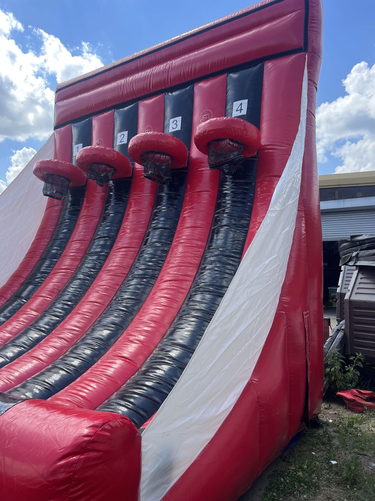Outdoor view of the red and black inflatable basketball game from below
