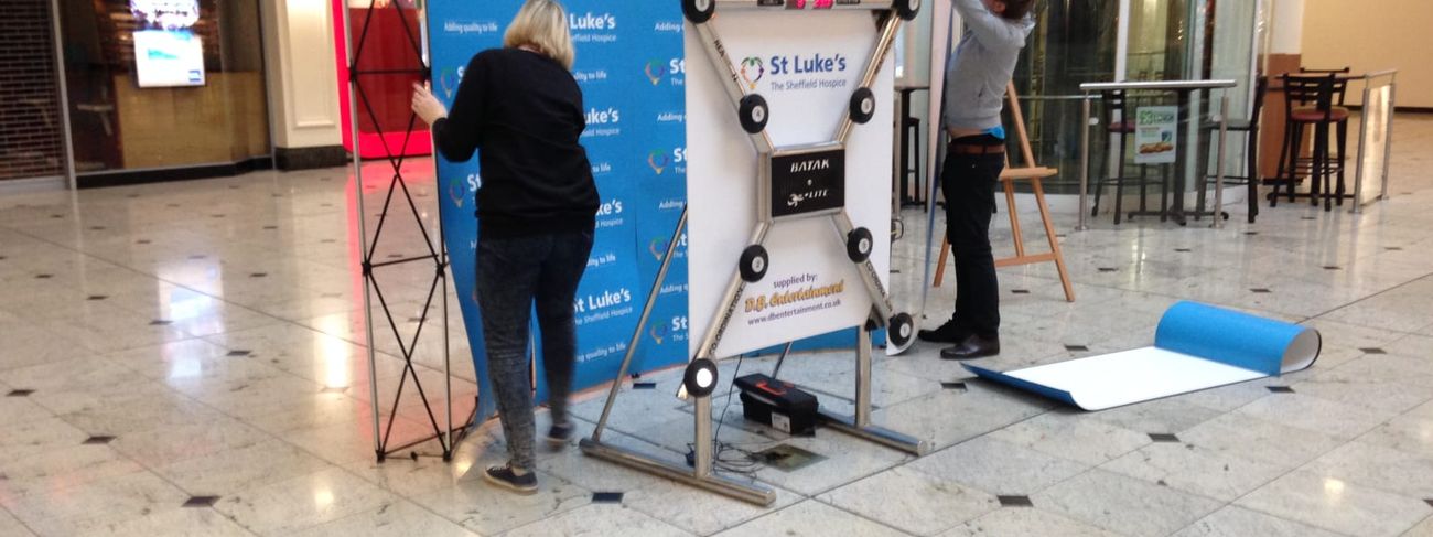 Batak Lite reaction wall set up at St Luke's Hospice shopping centre event with branded panels and magnetic leaderboard