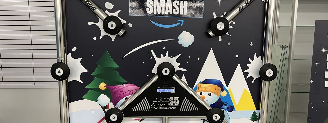 Batak Pro reaction frame with Peak Wonderland Snowball Smash winter-themed artwork, 12 numbered LED targets, two red digital score displays