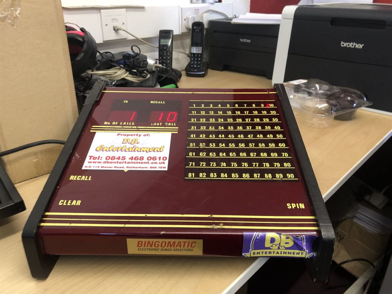 D.B. Entertainment branded Bingomatic console on a desk