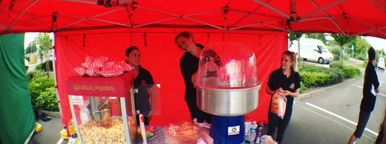 Outdoor gazebo stall with popcorn and candy floss machines
