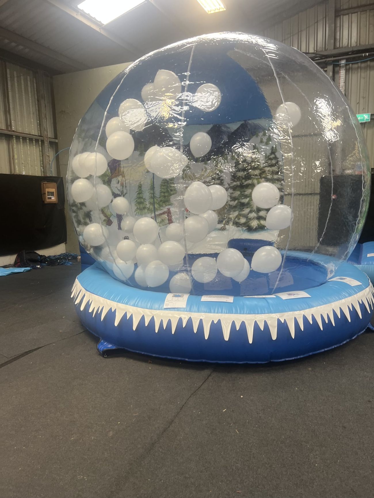 Balloon-filled globe ready for indoor event hire