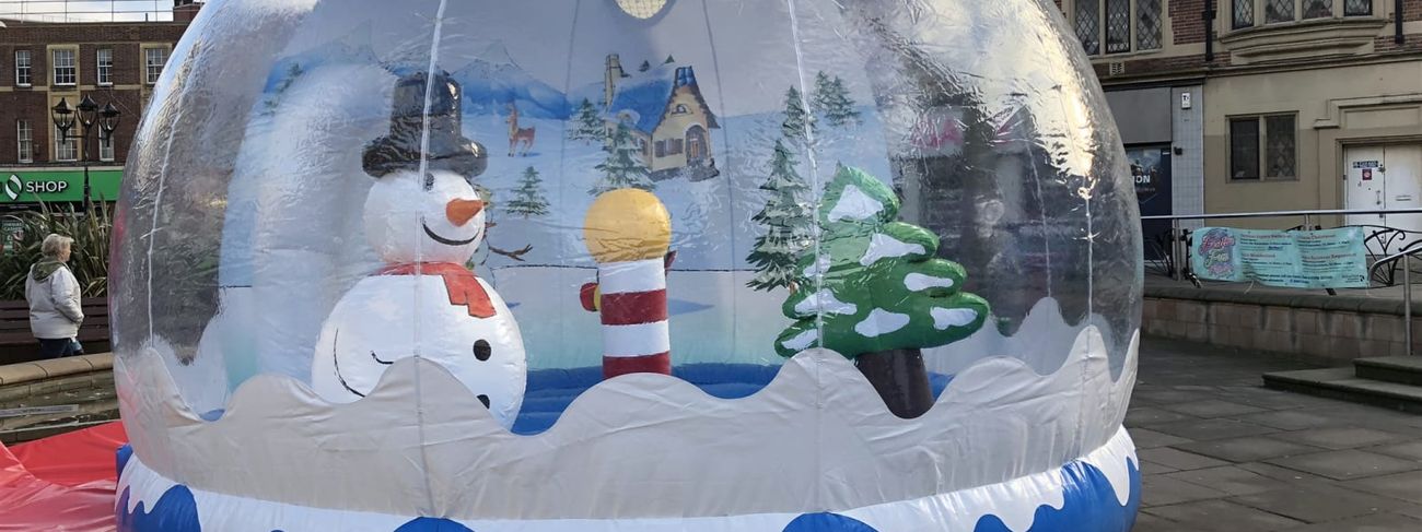 Inflatable snow globe set up in city square