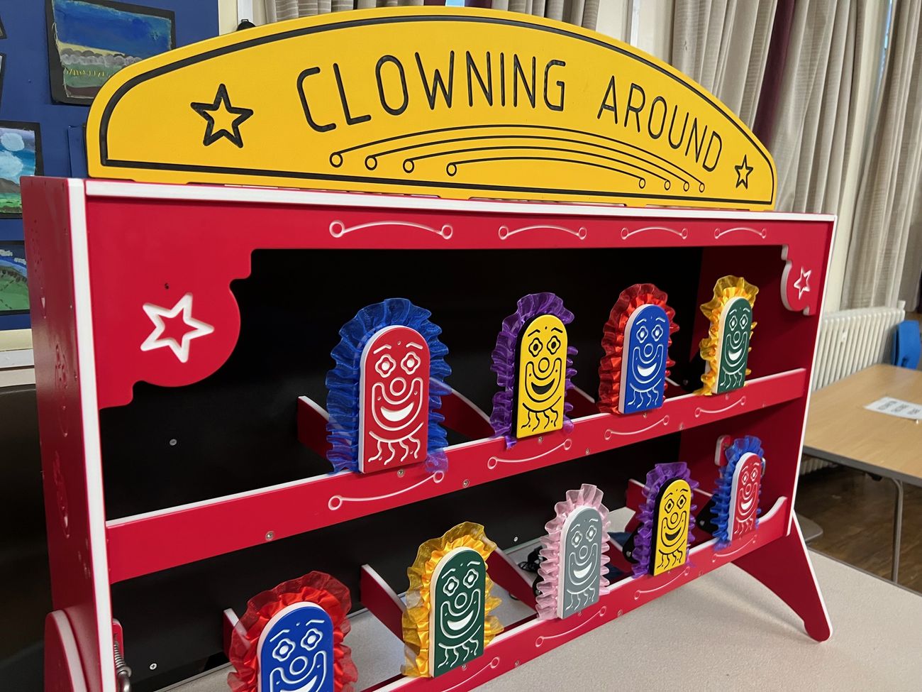 Close view of the Clowning Around sign and colourful knock-down clown targets