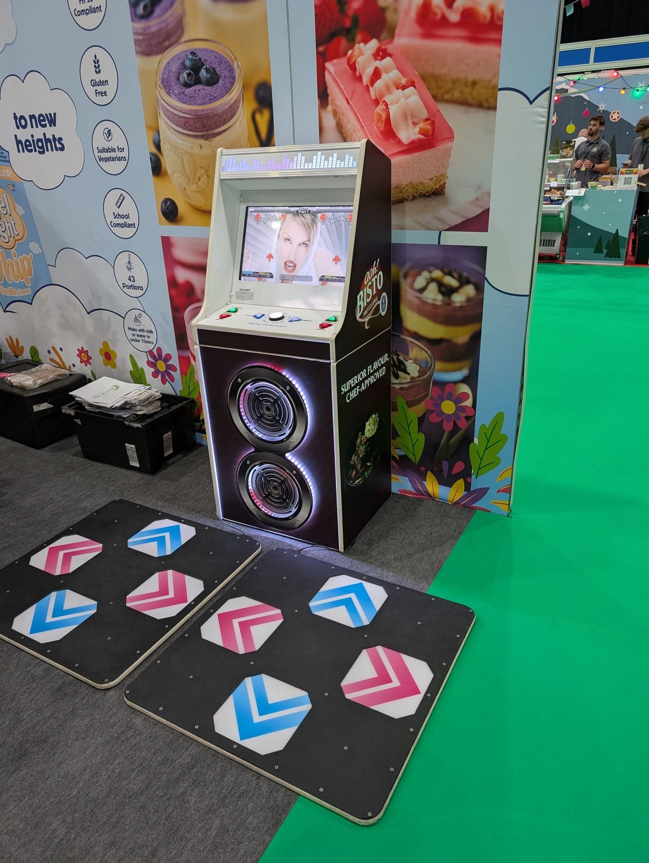 Bisto-wrapped dance machine cabinet with branded front and side panels and two arrow pads