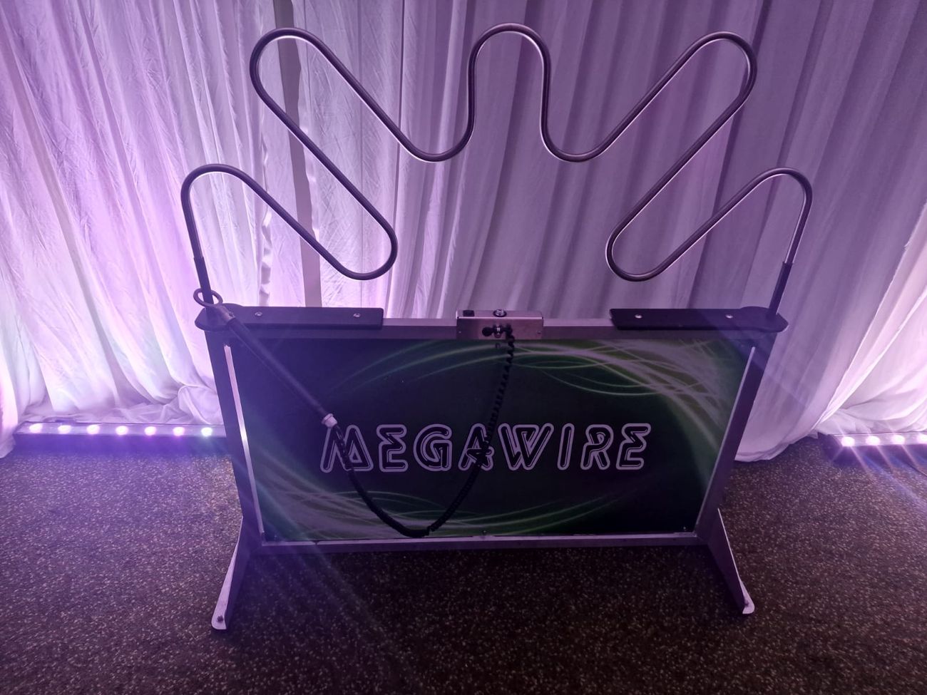 Megawire set up against draped event backdrop