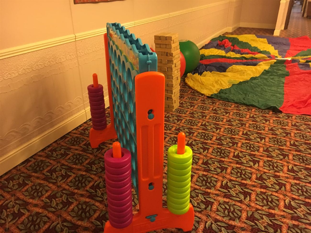 Game beside giant Jenga and parachute
