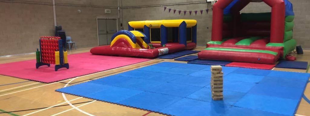 Jenga set up alongside bouncy castle and Connect 4