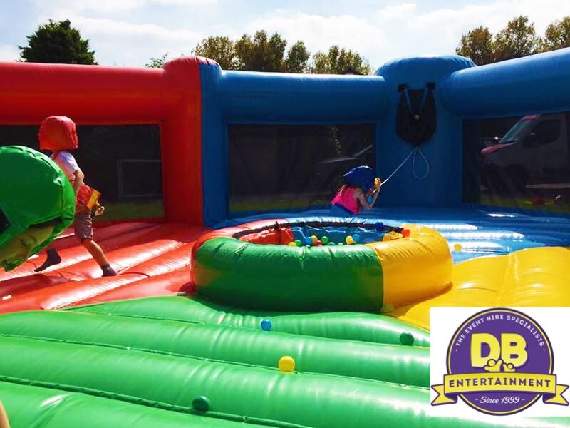 Teams taking part in Human Hungry Hippos on an inflatable arena