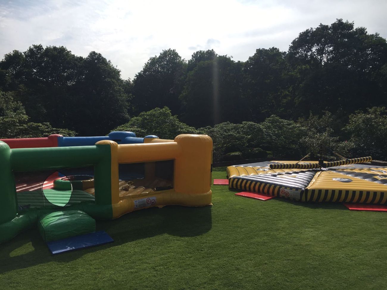 The four-colour inflatable Hungry Hippos arena set up on grass at an outdoor event