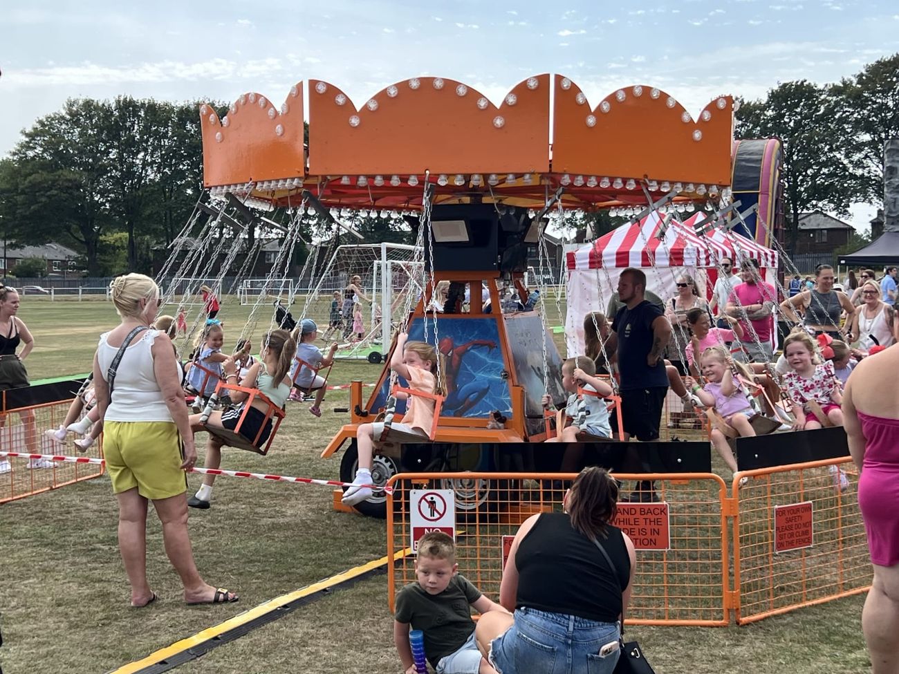Ride in motion with riders enjoying the spin