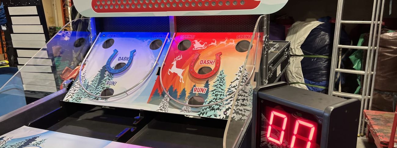 Large red LED digital timer showing 00 beside a Christmas bounce-a-ball game