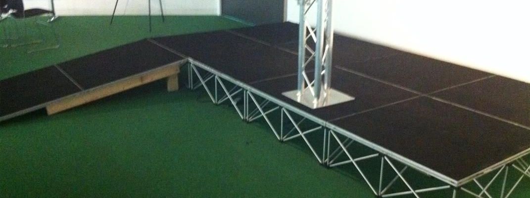 Aluminium truss lectern on a modular stage with an access ramp