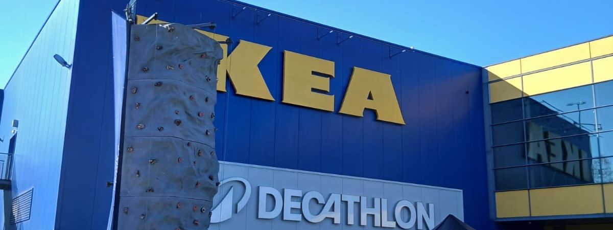 Mobile climbing wall carrying Decathlon branding outside the IKEA x Decathlon store in Croydon