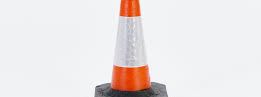 JSP RoadHog 500mm orange traffic cone with white reflective band and heavy black base on a white background