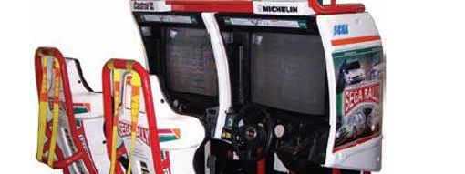 Original twin sit-down Sega Rally 2 Championship arcade cabinet with two linked cockpits, steering wheels and screens