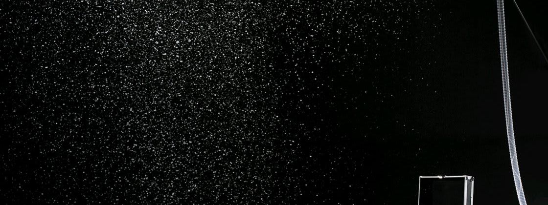 Antari snow machine spraying flakes through hose nozzle