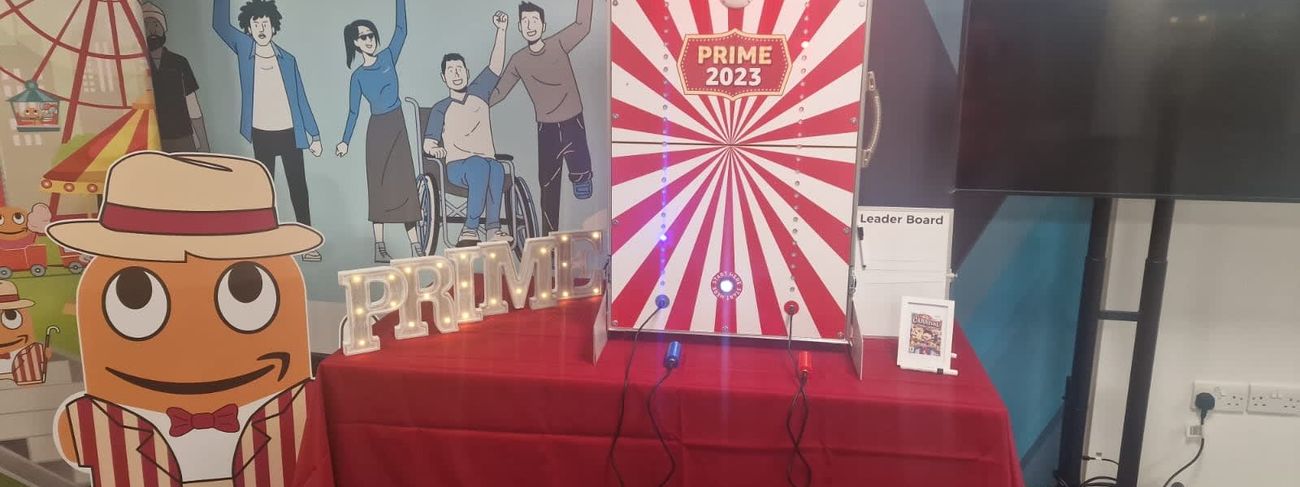 Spot On Challenge with Amazon Prime 2023 branding on a red-draped table at a corporate event