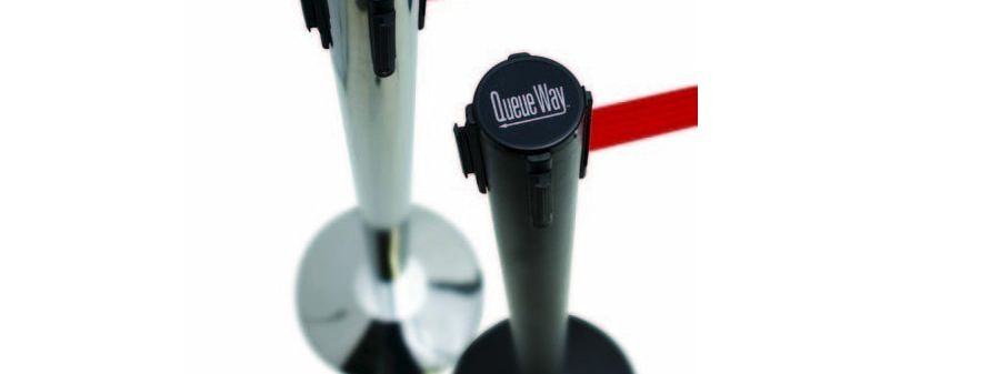 Chrome and black QueueWay belt barrier posts with red retractable belts