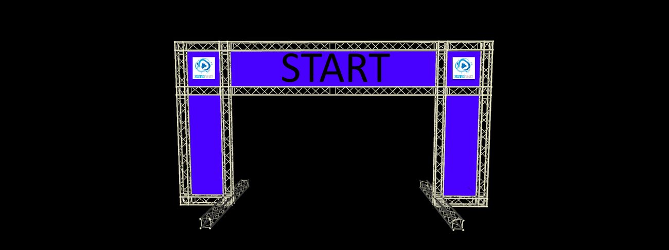 Freestanding metal truss gantry carrying a wide blue event banner over a start line